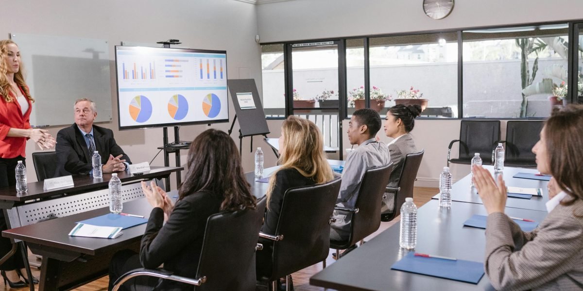 Individuals engaged in learning and development, highlighting the importance of upskilling the workforce for AI.
