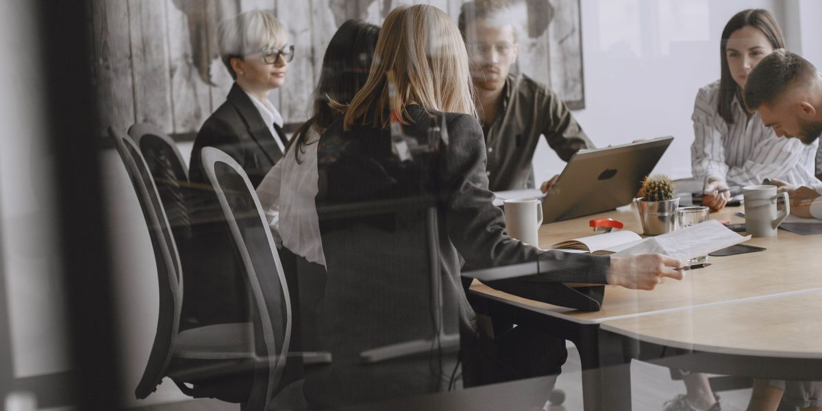 Business leaders actively discussing strategy, a crucial step in digital transformation decisions.