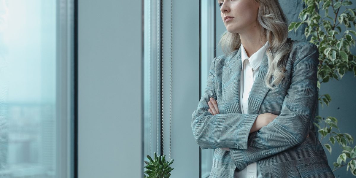 A business leader contemplating the complexity of choosing the right AI solutions amidst an overwhelming market.