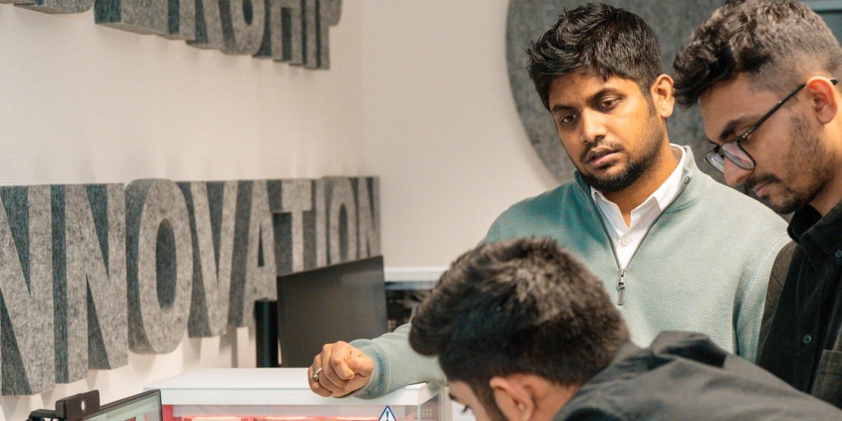 A group of employees actively participating in an AI-powered learning session, enhancing their skills.