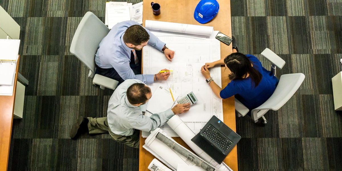 A team collaborating to evaluate project management tools and align on strategic goals.