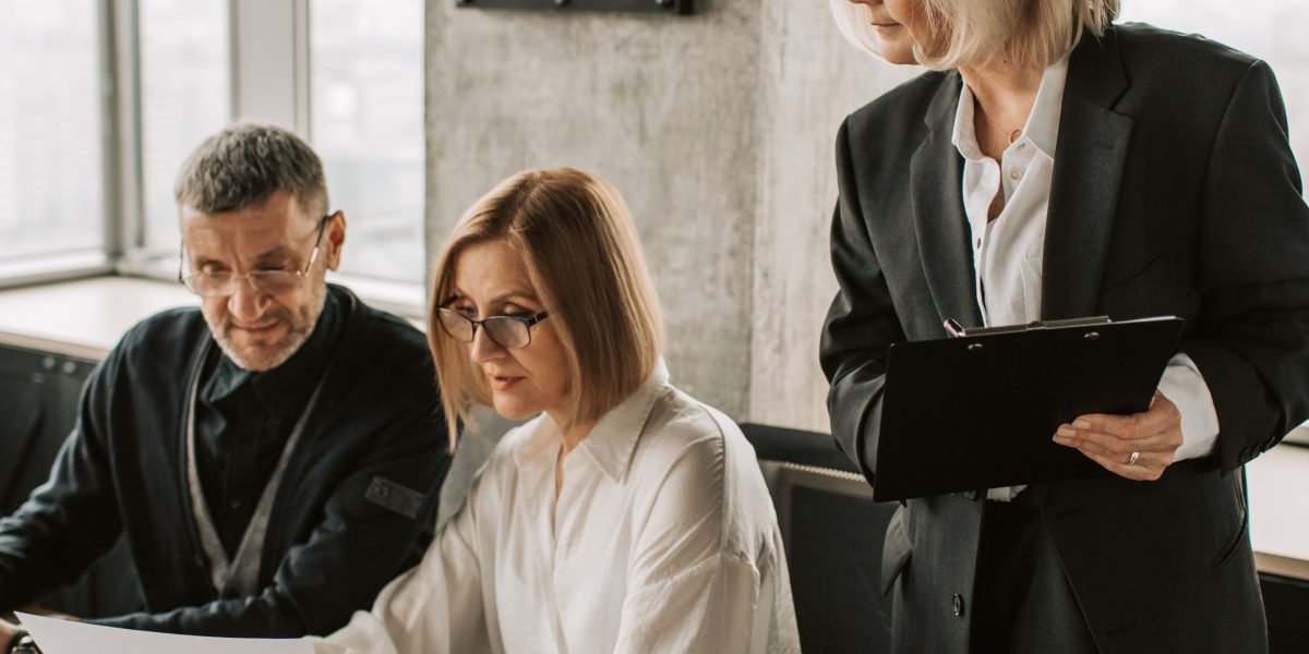 Enterprise leaders engage in a strategic discussion, emphasizing the critical decisions regarding AI talent and tools in 2026.