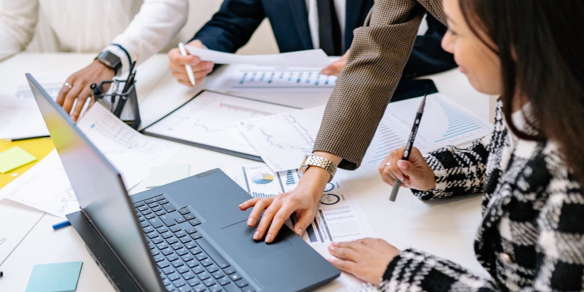 A team collaborates during a strategic meeting, laying the groundwork for a sustainable cloud research practice within their organization.