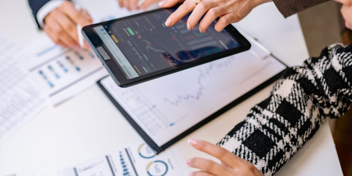 A diverse team works together, deeply analyzing data to uncover critical business insights.