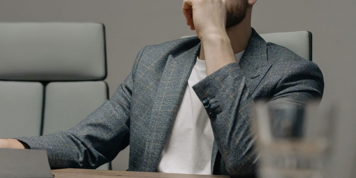A business leader deep in thought, considering the strategic implications of LLM adoption and market shifts.