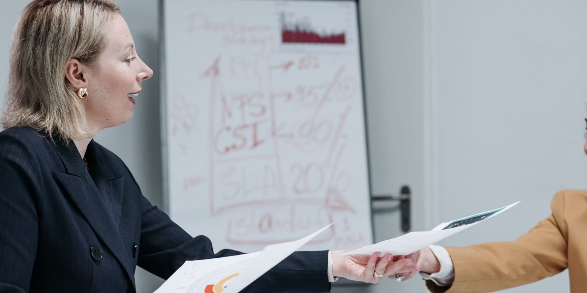 A confident professional presenting business results to colleagues, demonstrating successful LLM performance and ROI.