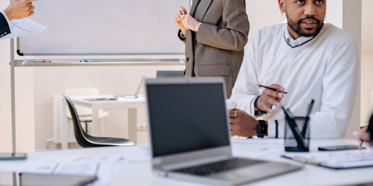 A business leader deeply focused, planning and strategizing to navigate the complexities of AI adoption effectively.