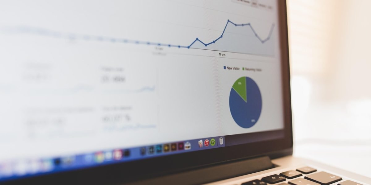 A professional analyzes data on a dashboard, representing the critical practice of monitoring AI model performance.