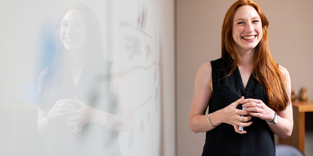 A professional presents information, illustrating the importance of communicating complex AI concepts to non-technical stakeholders.