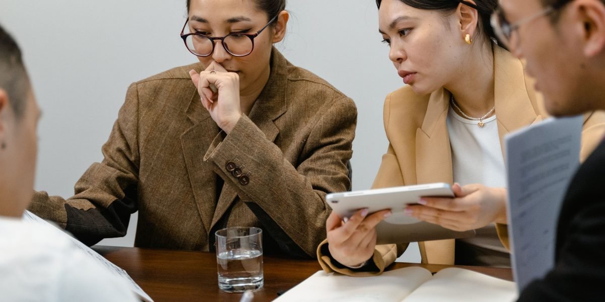 A team carefully weighing options and making a critical decision about staffing needs.