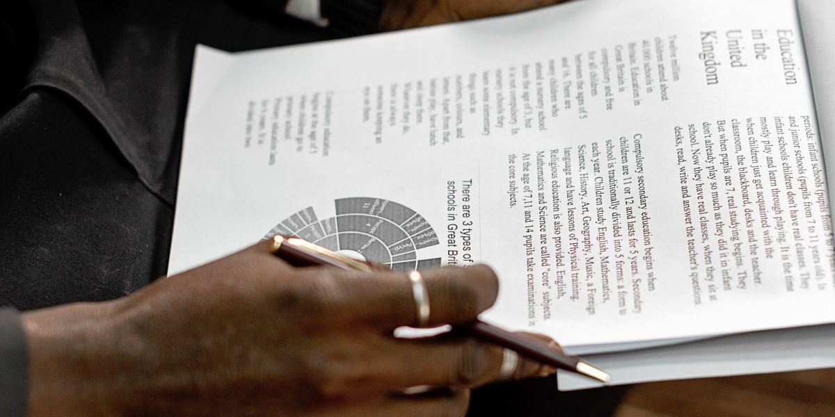 Business leaders meticulously reviewing a financial report to assess potential return on investment.