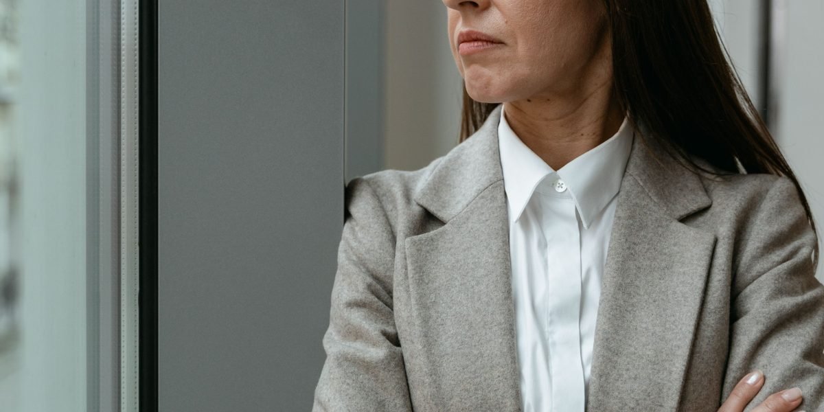 A confident business leader thoughtfully considering future strategies, symbolizing the impact of advanced data ecosystems.