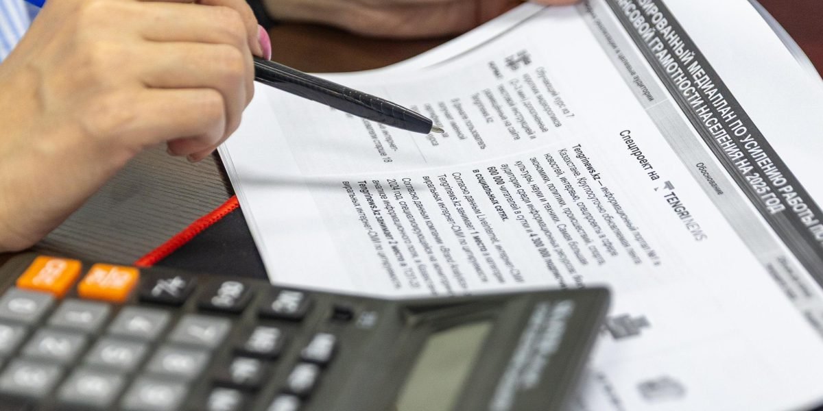 A person meticulously reviews financial documents, looking for opportunities to optimize costs in cloud API management.