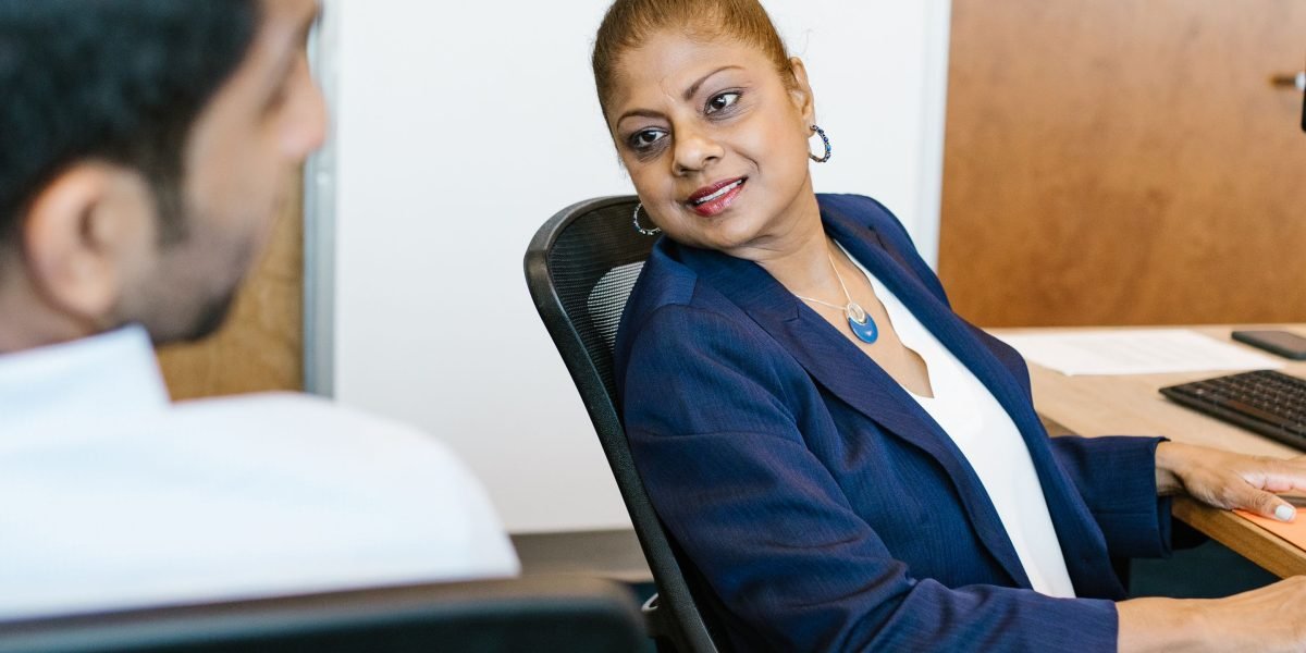 A manager and an employee engaged in a one-on-one discussion about career development and growth opportunities.