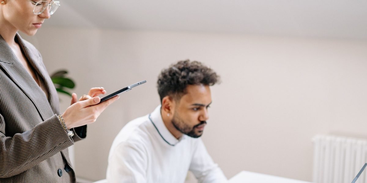 A manager provides guidance and coaching to a team member, fostering skill development and adaptability in an evolving work environment.