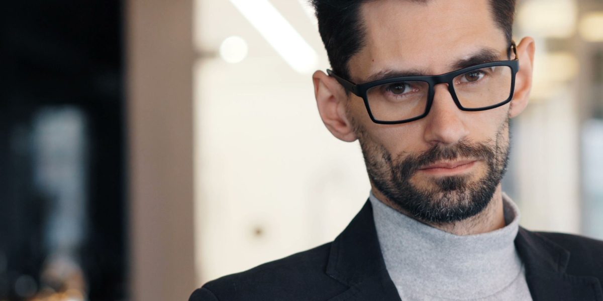 A business leader deep in thought, grappling with the complexities of modern IT infrastructure challenges and rapid technological changes.