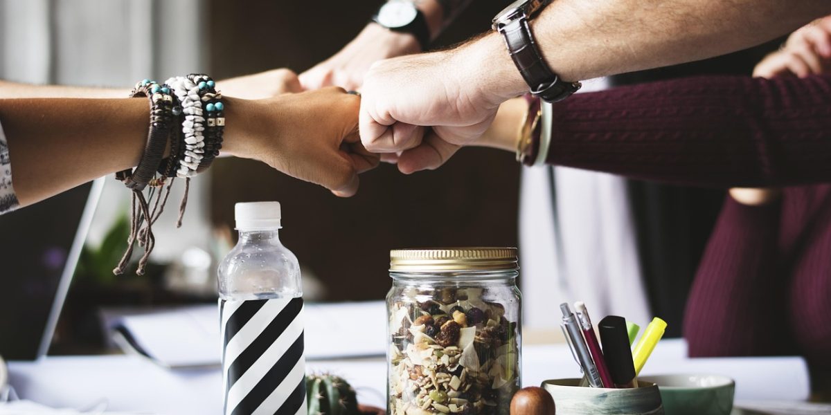 A team collaborating in an office, reviewing charts and reports to gain business intelligence insights.