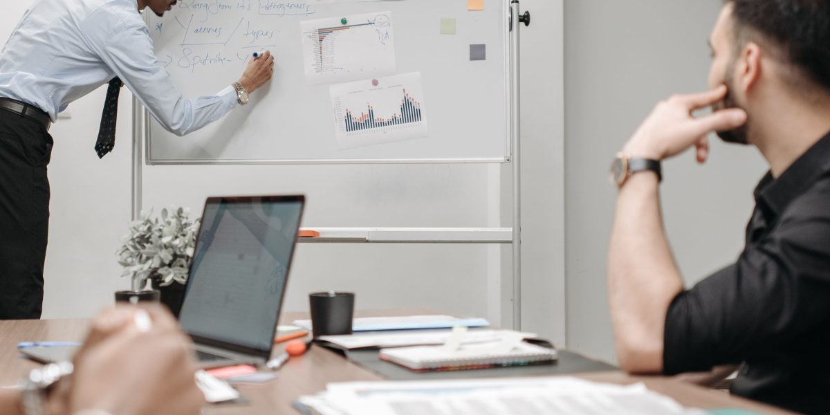 A diverse team working together, sharing ideas and insights around a common goal.