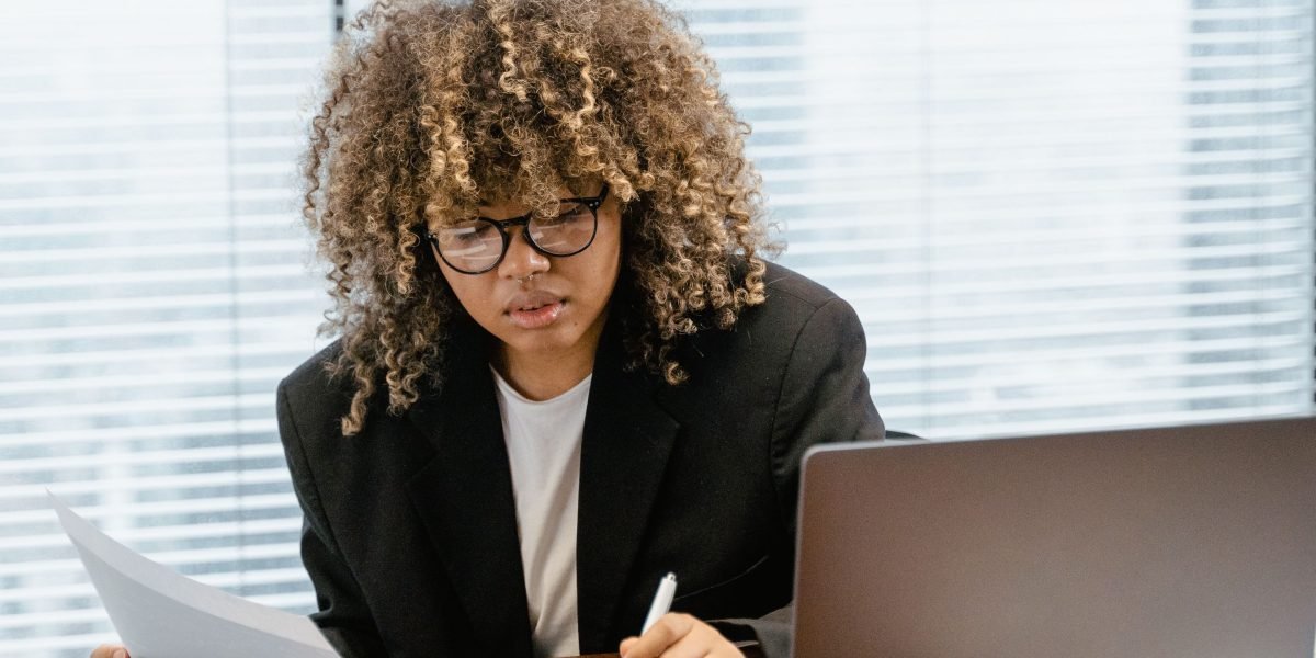 A business professional analyzing a data dashboard to evaluate project efficiency and make informed decisions.